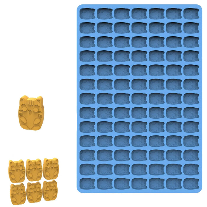 Blue cat-shaped silicone mold with yellow cat shapes.