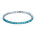 Silver tennis bracelet with blue stones on a white background.