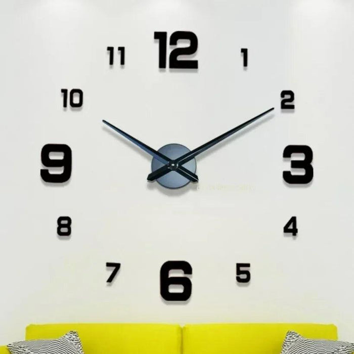 A large wall clock with black numbers and hands, mounted above a yellow couch with striped cushions.