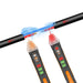 The voltage tester pen detecting a break in a black and red wire, illustrated with electrical currents.