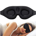 Woman sleeping while wearing the black contoured sleep mask.