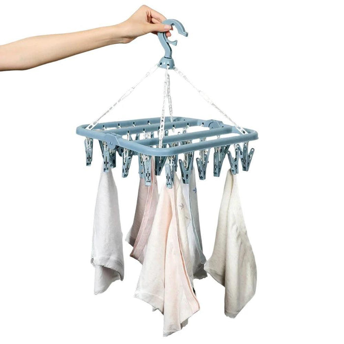 Folding Clothes Dryer Rack holding clothes