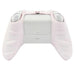 The back view of a white game controller with a light pink grip cover, highlighting the controller's ergonomic design.