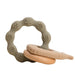 A gray silicone teether ring with beige various textured patterns and a wooden ring attached to it.