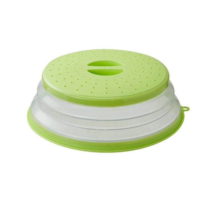 Green collapsible microwave food cover on white background.