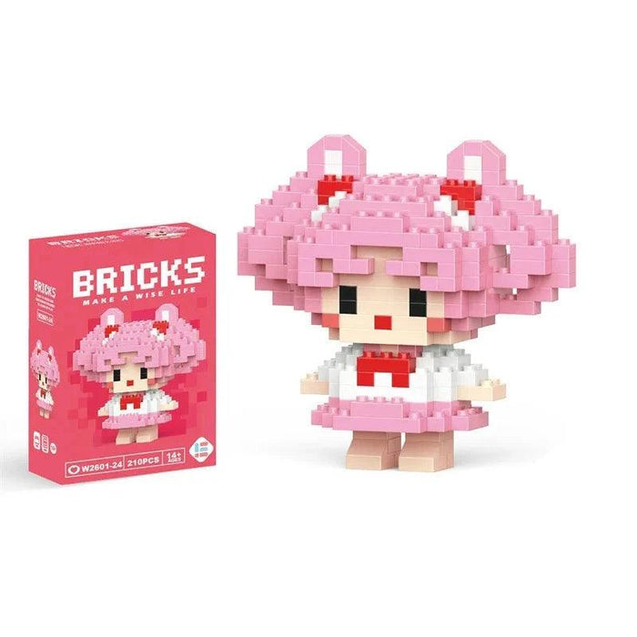 A single block-style toy figure of a girl with pink hair, along with its pink packaging box. Display on white background.