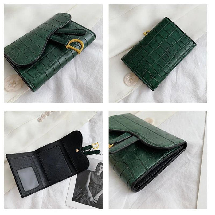 A collage showing different angles of a green crocodile-pattern wallet with a gold "D" buckle, placed on a white fabric surface.