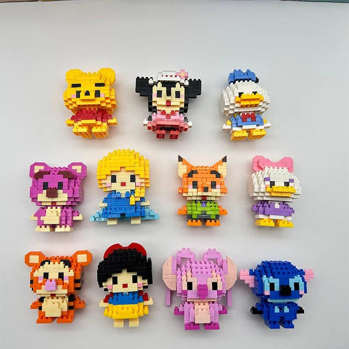 The image shows 11 block-style toy figures representing various popular characters, including Winnie the Pooh, Minnie Mouse, Donald Duck, Daisy Duck, and others.