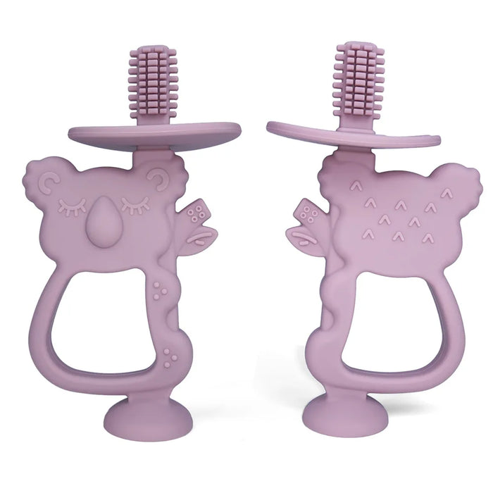 Two purple silicone teethers shaped like koalas with built-in toothbrush bristles on top.