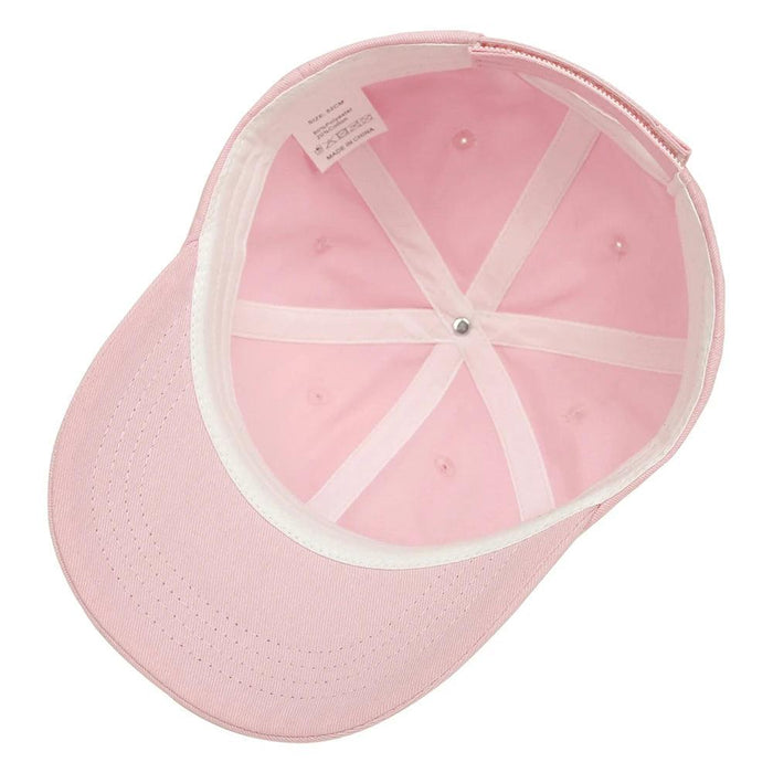 The interior of a pink cap, showing its construction and seams.