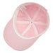 The interior of a pink cap, showing its construction and seams.