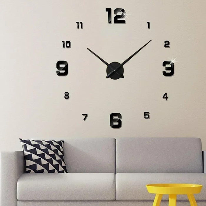 A wall clock with black numbers and hands, mounted above a gray couch with a yellow table in front.