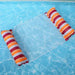 Inflatable pool float with gradient red and orange colors in the water.