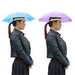 Two head-worn umbrellas: one in solid blue and the other in solid purple.