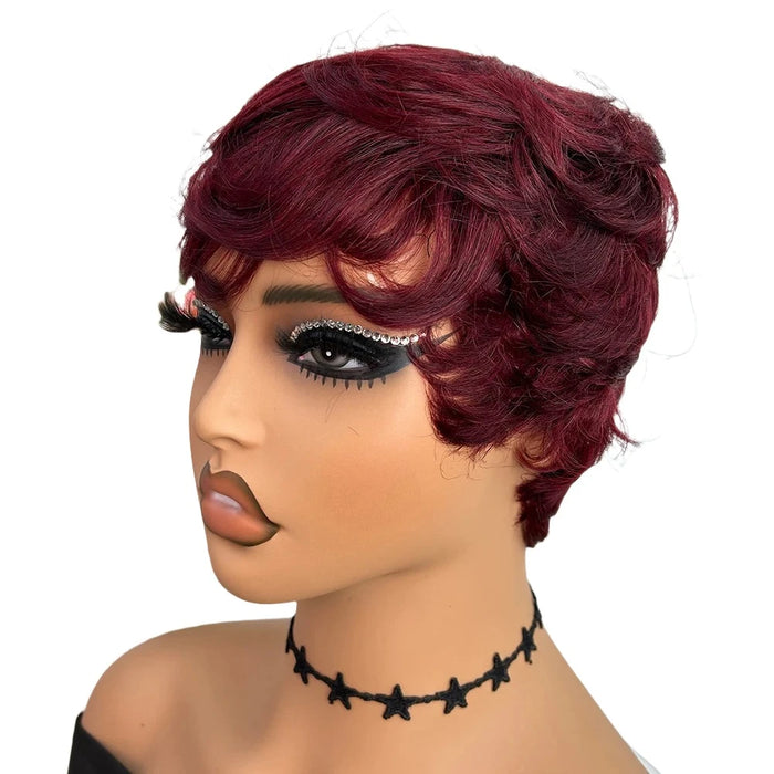 A mannequin with a short, wavy, red wig, wearing dramatic makeup.