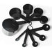 the entire set of black measuring cups and spoons, laid out and fanned in a circular pattern. The set includes multiple sizes for both cups and spoons, all connected by rings for easy storage. The glossy finish is consistent across all pieces.