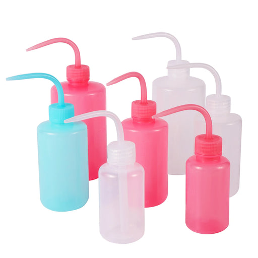 Seven Transparent, blue and pink Plastic Safety Wash Bottles.