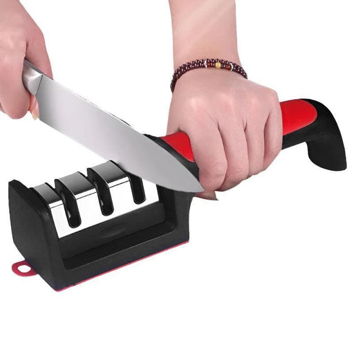 Knife Sharpener with a hand sharpening a knife