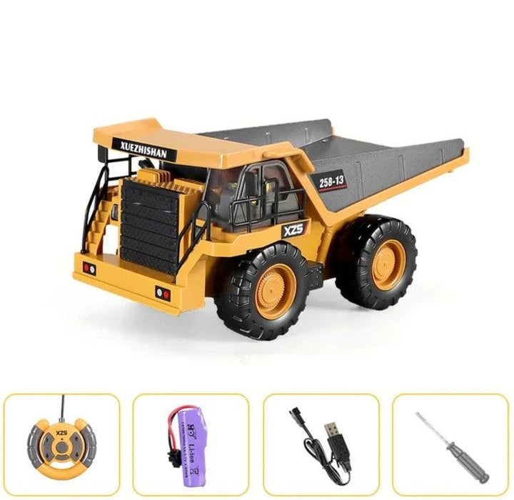 Yellow toy dump truck with remote control and accessories.