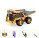 Yellow toy dump truck with remote control and accessories.