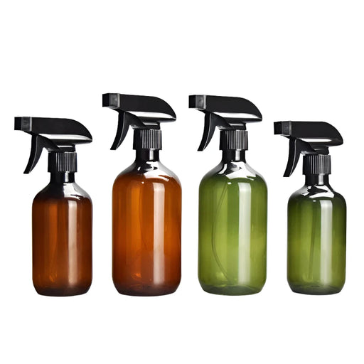 Four spray bottles, two amber and two green, in a row with black spray heads.