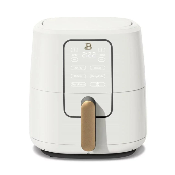 A sleek white air fryer with a gold handle, featuring a digital display and various cooking options.