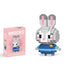 A single block-style toy figure of gray bunny, along with its pink packaging box. Display on white background.