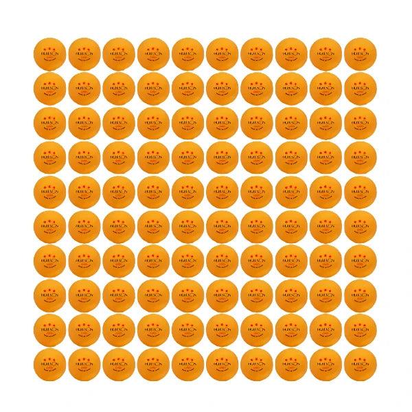 One hundred orange Huieson G40+ table tennis balls arranged in a grid, each with three red stars and "Made in China" text.