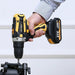 a hand holding a yellow and black cordless power drill by Yikoda, actively being used to drive a screw into a piece of equipment. The drill is powered by a 21V lithium battery, emphasizing its cordless convenience and ergonomic design.