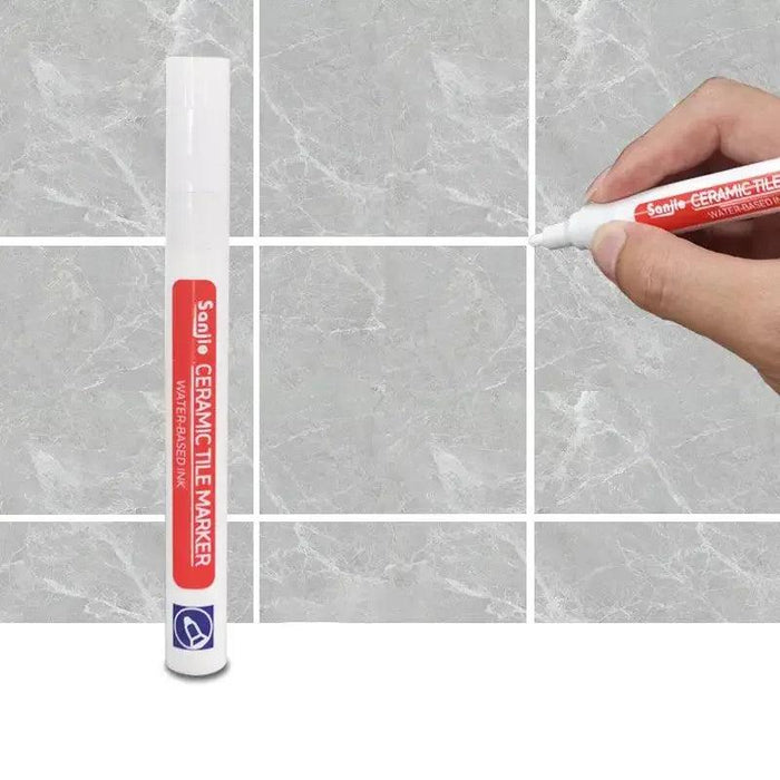 A white ceramic tile marker in use on a marble-like tile surface, clearly defining grout lines for a polished and clean finish.