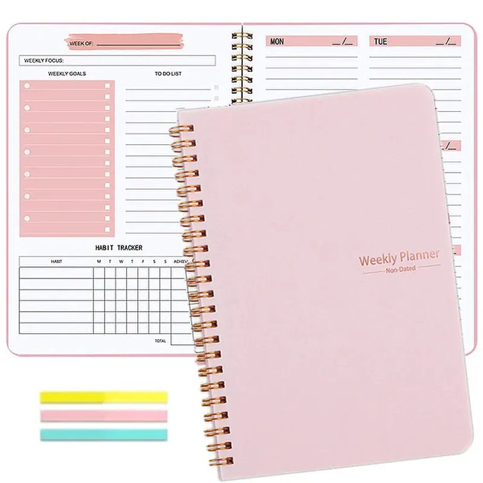 A pink spiral-bound weekly planner with the cover text "Weekly Planner Non-Dated" in gold. The planner is open to show the layout for a weekly schedule and to-do list. Colorful sticky notes are also included in the image.