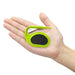 A green pet grooming tool shown in the palm of a hand for size reference.