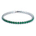 Silver tennis bracelet with green stones on a white background.