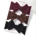 A set of 3 Baby Bow Headbands with different colors.