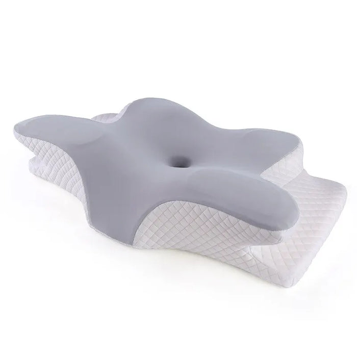 A close-up image of the grey and white butterfly-shaped orthopedic pillow, designed to support the head and neck.