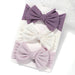 A set of 3 Baby Bow Headbands with different colors.