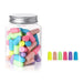 A jar filled with Mixed-color earplugs. With 6 colorful earplugs beside it.