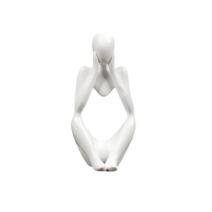 White minimalist abstract sculpture of a figure sitting with hands placed on either side of the head.