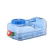 A Transparent Blue water container with Faucet.