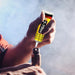 A hand applying T-7000 adhesive to a small electronic component.