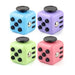 Four colorful fidget cubes in blue, purple, green, and pink, each with different tactile features.