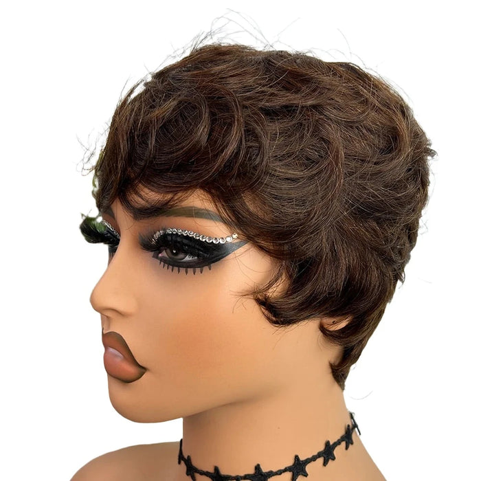 A mannequin with a short, wavy, brown wig, also wearing dramatic makeup.