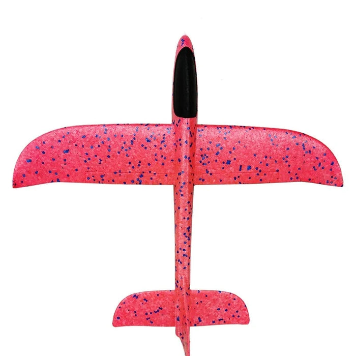 a top-down view of the fully assembled orange foam glider with pink speckles, emphasizing its simple yet effective design.