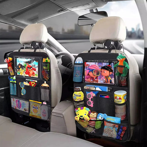 Two black backseat organizers in a car, each holding toys, snacks, and tablets displaying cartoons.