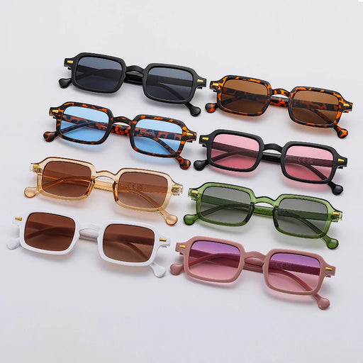 A collection of rectangular sunglasses in various colors, including black, tortoiseshell, blue, pink, gold, green, white, and pink, displayed on a light gray background.