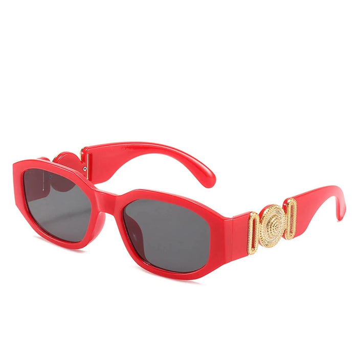 Red sunglasses with gold accents on the arms, showcasing the full frame and design, displayed on a white background.