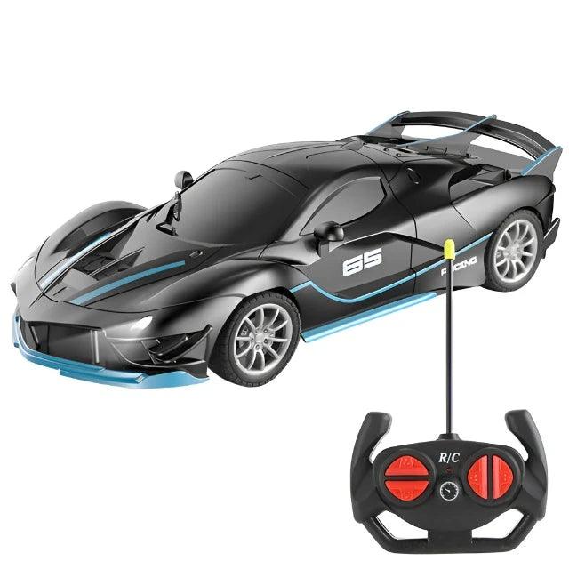 A black sports car with blue accents and an accompanying remote control.