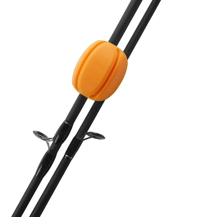 An orange silicone rod holder attached to two fishing rods, securing them together in a neat and organized manner.