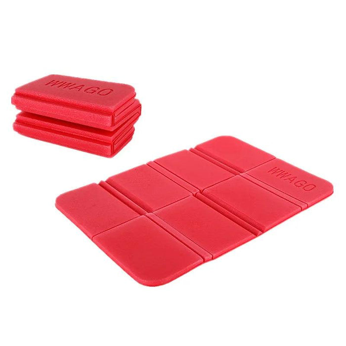 Red Foldable Foam Mats: Two foldable foam mats, one in black and the other in blue, placed side by side, both featuring a textured surface with a pattern of raised dots for cushioning and support.