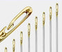 Various golden-headed sewing needles arranged in a stair shape to display their design.